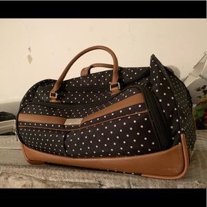 A navy blue and white polka dot travel bag!